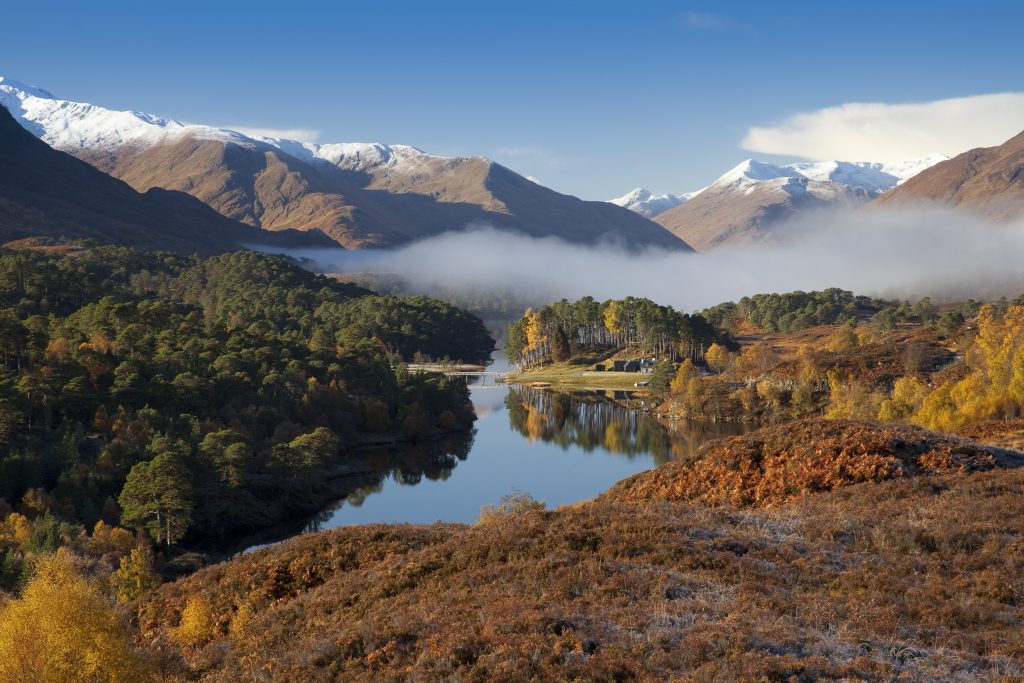 Looking west along Loch Affric to snow topped mountains